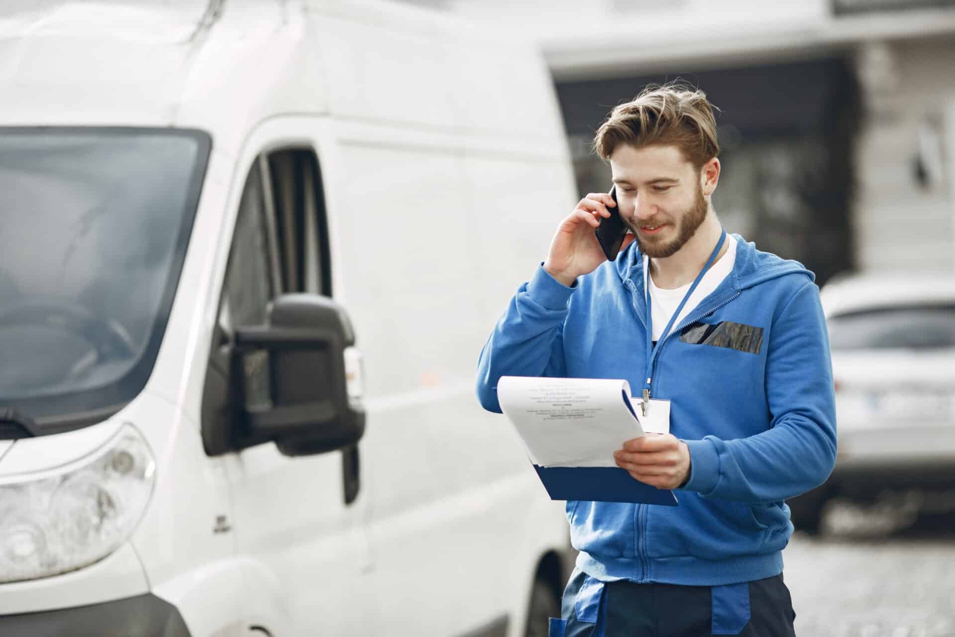 man by truck guy delivery uniform man with clipboard scaled